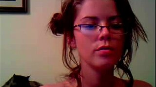 Horny cam girl wearing glasses plays with her pussy
