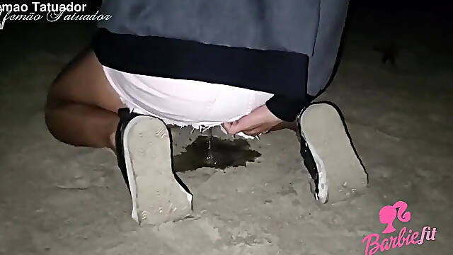 Barbie Fit gets pissed on the beach, exhibitionist fetish