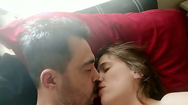 Vigorously smooching While tugging Off