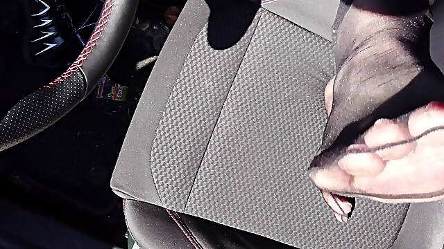 Feet of Nylonjunge in Pantyhose in Car