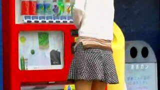 Sweet oriental chick is standing by the vending machine as she.s picking her favorite drink during very hot day, but all of a sudden some chap comes and starts striping her clothes until hot girl.s boobs are totally exposed.