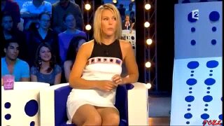 This blonde, hot ass babe is a local celebrity who wore a dress too short for sitting on a chair. She offers us a few juicy shots of her upskirt as she changes position right on live television!