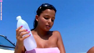 This lovely looking young angel with breathtaking bubble ass and big boobs plays a mischievous solo on a yacht. She spills some liquid on her ass and pussy and pokes herself crazily