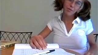 Hot pigtail teen doing homework shows us her boobs