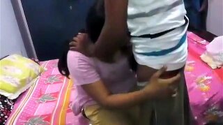Indian girlfriend in bed with pink top and her panty and salwar pulled down exposing her lovely ass cheeks getting caressed and boyfriend fingering her pussy during sex foreplay in this MMS.