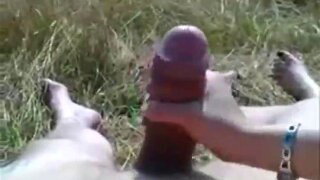 Girlfriend jerks a huge cock.