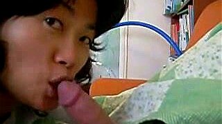 Korean housewife sucking on cock as soon as she wakes wearing her husband's pajamas in this amateur Asian fucking movie. You can see her lick and suck cock like a lollipop