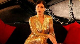 Unleash your submissive side for the ultimate thrill ride with this dominant German milf in a golden catsuit. Let her heels and nipples guide you on a POV journey of pain and pleasure.