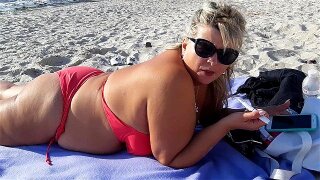 Smoking fetish. Big boobs relaxing on beach and smoke