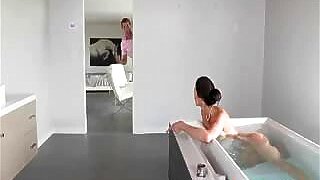 Stepson sneaks on her busty stepmom masturbating in the tub