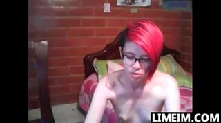 Girl wearing glasses plays with her pussy on a cam show