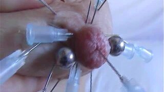 Injection saline in a breast. Piercing play with the nipple in the other tit and milking squirting. Fucking a champagne bottle in pussy until orgasm.