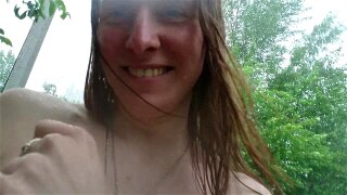 Public boobs flash outdoors in the rain