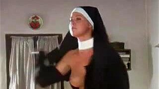 Brunette slave girl is naked with her big tits hanging out is tied up like a slut and whipped by a nun in a sanctuary.