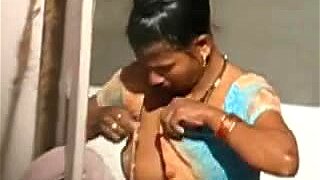 Pregnant Indian chick with big boobs takes a shower
